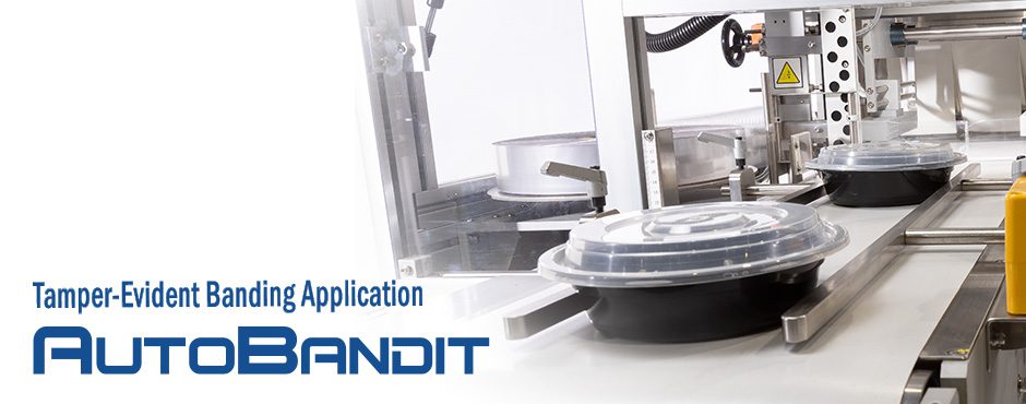 Automated robotic system handling petri dishes in a lab.