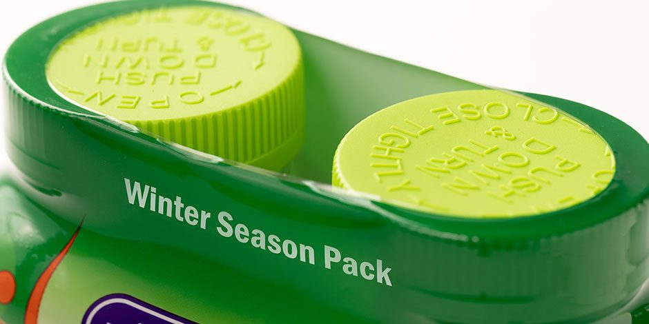 Close-up of green containers labeled 'Winter Season Pack'.